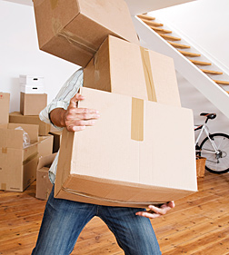 man with boxes - Copyright – Stock Photo / Register Mark