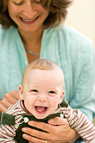 woman holding baby - Copyright – Stock Photo / Register Mark