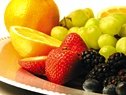 Plate full of fruit. - Copyright – Stock Photo / Register Mark