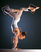 Female gymnast performing handstand. - Copyright – Stock Photo / Register Mark
